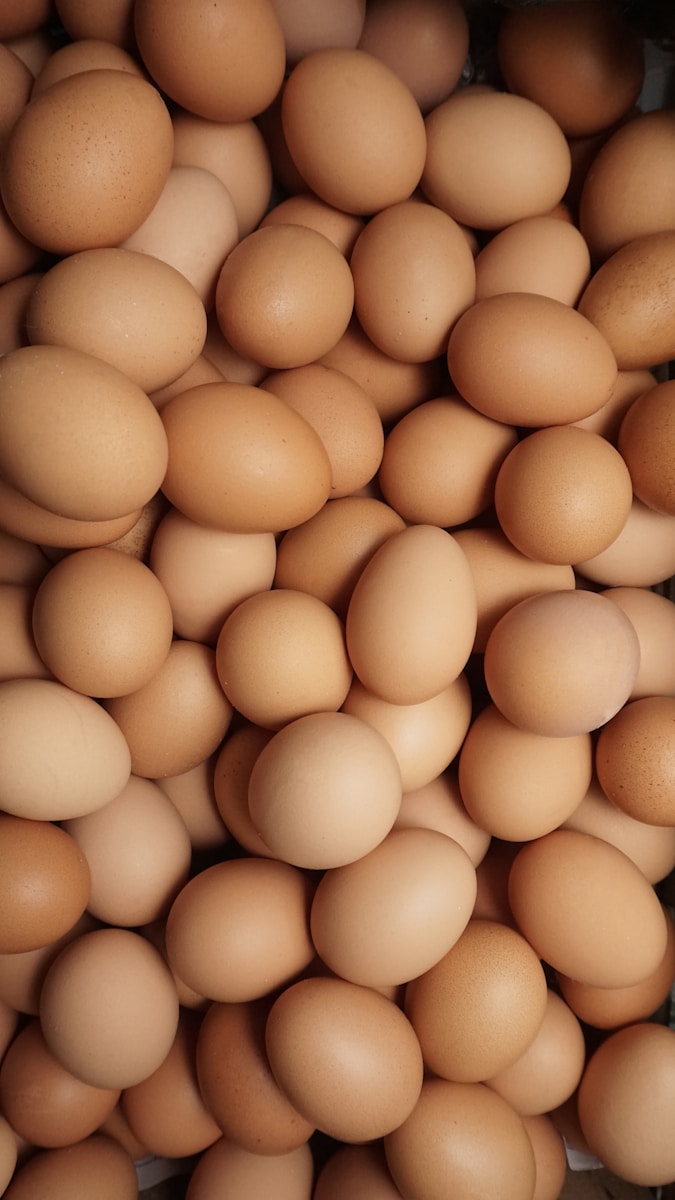 Food fusion turns a pile of eggs into curried egg salad with green olives.